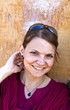 portrait of beautiful caucasian woman with old wall as backgroun