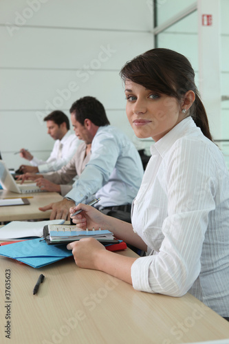 Photo: Woman writing in her agenda Woman writing in her agenda