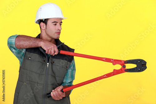 Photo: Tradesman holding large clippers Tradesman holding large clippers