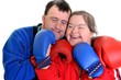 couple with down syndrome in boxing gloves on white couple with down syndrome in boxing gloves on white