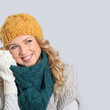 Portrait of woman on white background wearing woolen accessories