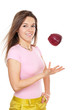 Photo: Young happy woman throwing apple Young happy woman throwing apple