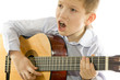 boy with an acoustic guitar isolated on white