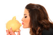 Happy woman with her savings in a piggy bank Happy woman with her savings in a piggy bank