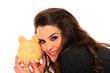 Happy woman with her savings in a piggy bank Happy woman with her savings in a piggy bank