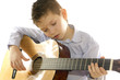 boy with an acoustic guitar isolated on white