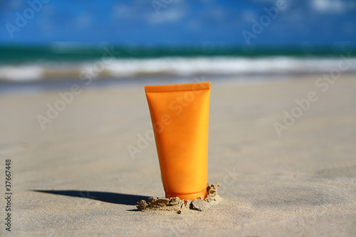 Photo: Tube with sun protection on beach Tube with sun protection on beach