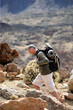 Man backpacking though the mountains