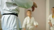 coach at the gym teaches children Martial Art