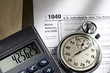 Tax form, stopwatch and calculator