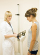 doctor weighing the patient