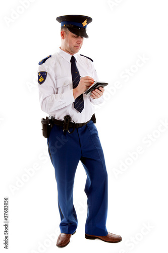 Photo: Dutch police officer filling out parking ticket Dutch police officer filling out parking ticket