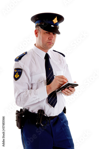 Photo: Dutch police officer filling out parking ticket Dutch police officer filling out parking ticket