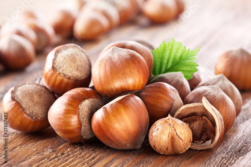 Photo: Filberts on a wooden table. Close-up shot. Filberts on a wooden table. Close-up shot.