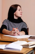 Photo: Female teacher in classroom Female teacher in classroom