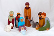 Figures representing nativity scene on white background