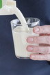 Photo: Woman pouring fresh milk Woman pouring fresh milk