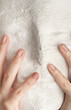 Photo: White mask and two hands White mask and two hands