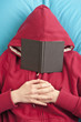 Photo: Lying down with book covering face Lying down with book covering face