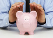 Businessman protecting his savings