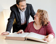 Adult couple behind book