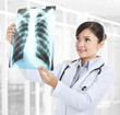 Female doctor looking at an x-ray