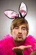 Man in bunny ears blowing kiss Man in bunny ears blowing kiss