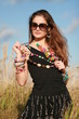Young woman holding the necklaces Young woman holding the necklaces