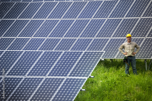 Photo: Technician at solar power station Technician at solar power station