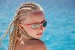 The girl in pink glasses with the African plaits. A portrait