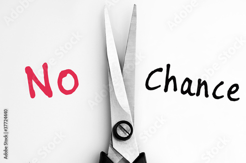 Photo: No and Chance words with scissors in middle No and Chance words with scissors in middle