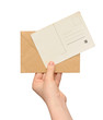 yellow envelope with vintage blank card in the hand yellow envelope with vintage blank card in the hand