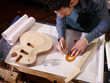 Photo: italian artisan working in lutemaker workshop italian artisan working in lutemaker workshop