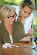 Woman looking at her pills