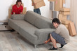 picture of friends moving a couch