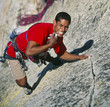 Climber dangling from the edge.