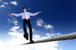 Business man balancing on the rope