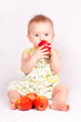 small child eats an Apple; sticking your tongue;