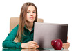 Photo: Beautiful woman office worker with laptop and apple Beautiful woman office worker with laptop and apple