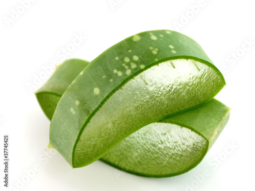 Photo: A stack of freshly sliced Aloe Vera on white background A stack of freshly sliced Aloe Vera on white background