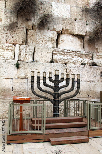 Photo: Jewish hanukkah candle holder at the Western Wall. Jerusalem. Jewish hanukkah candle holder at the Western Wall. Jerusalem.