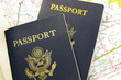 Closeup of US passports on a map