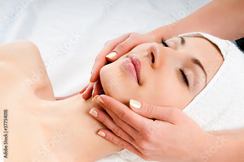 Photo: woman receiving facial massage woman receiving facial massage