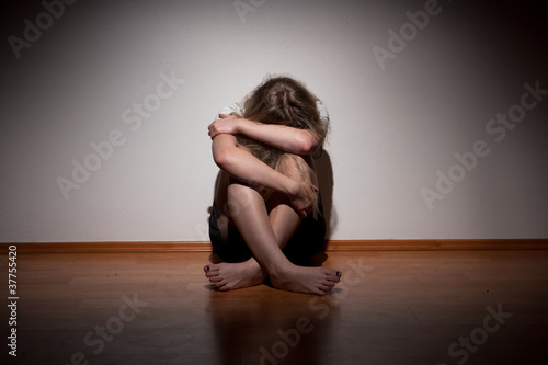 Photo: Depressed young lonely woman Depressed young lonely woman