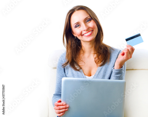 Foto: Smiling Woman shopping online with credit card. E-shopping Smiling Woman shopping online with credit card. E-shopping