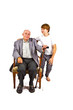 old man sitting in the armchair with his grandchild old man sitting in the armchair with his grandchild
