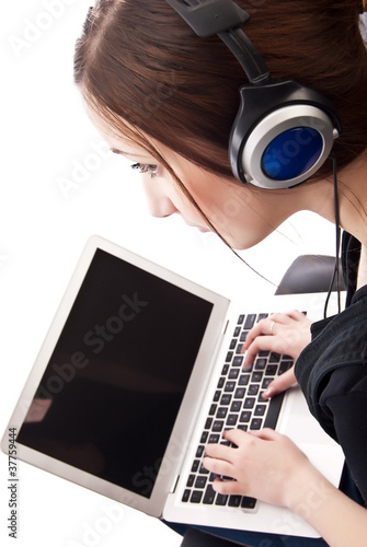 Photo: A young woman with a laptop, isolated on white, from above A young woman with a laptop, isolated on white, from above
