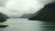 lake in the fog with a small boat