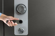 Photo: Hand opening a large safe Hand opening a large safe