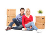 Boyfriend and his girlfriend sitting and resting after moving in
